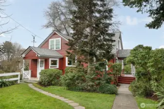 The path to the right goes from the alley parking to the main front door entrance, and the left path takes you to the mudroom (and a couple steps down to the DADU entrance).