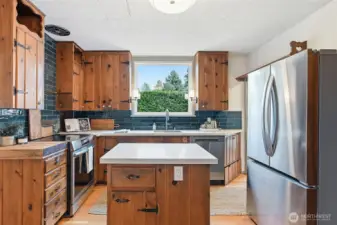 Big window in the kitchen brings in lots of natural light.