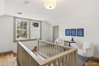 Upper floor landing has lots of extra space -- use it as an office, reading lounge, playroom, you name it.
