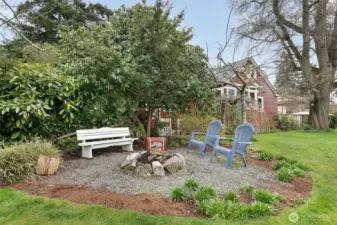Built-in stone fire pit makes for another great "outdoor room" to enjoy the yard and views.