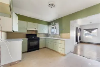 Lots of cabinets and countertops in this quaint kitchen!