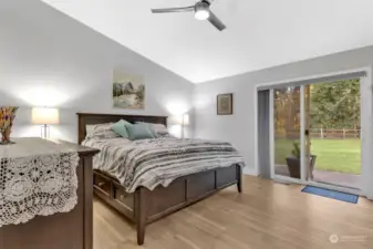 Primary bedroom with slider to the back yard.