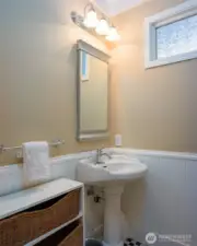 Half-bath on main floor off of the kitchen and entrance to garage