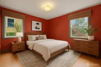 This is a virtually staged image of one of 2 bedrooms that enjoy oak hardwood flooring. The newer windows face north and east.