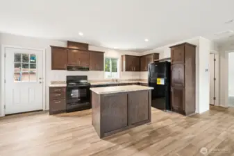 There is a back-door that exits out from the kitchen.