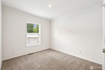 2nd Bedroom with carpet underfoot.