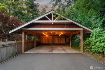 Carport holds 2 cars + additional uncovered parking.