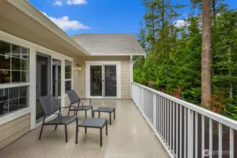 Step out from the primary suite and enjoy a cup of coffee while listening to the birds sing and chatter with one another.