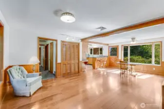 Open family room, dining and kitchen has pantry and LVP flooring for easy maintenance