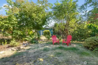 The yard has multiple fruit bearing trees, from Italian plum, several apple varieties, blueberry bushes, cherry, garden space and 2 massive sequoia trees planted by owner
