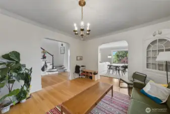 Unit B dining room, looking toward entry hall and living room.
