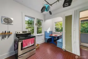 Unit A kitchen, with built-in eating nook and side door.