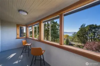 Enclosed bay view balcony, accessed through Unit A main bedroom.