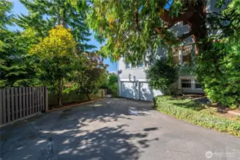 Double garage is accessed down shared driveway.
