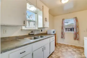 A kitchen with an eating nook—ready for a complete refresh.
