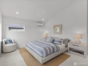 The sumptuous primary suite with soaring vaulted ceilings! Model home.