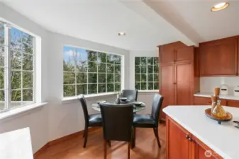 A breakfast nook looking out toward the trees is a great place to start your day.