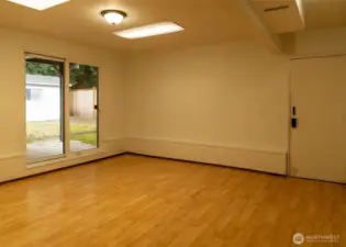 The lower level includes  both a large room that could be a 2nd main bed, or has potential as a home office or hobby space.