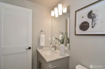 Upper level tiled full bath.