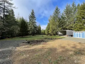 Looking across backyard from the edge of the driveway.