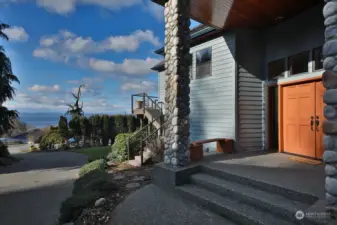 Grand entrance with river rock pillars. You capture some view here as well. Double door entry.