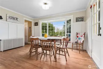 Picture perfect bay window with bench seating looks out toward the front of the home.