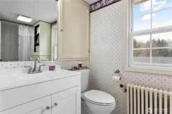 One full bathroom upstairs which has a large built-in medicine cabinet and additional linen cabinet.