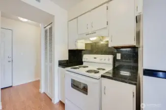 Kitchen looking to Entry. New Refrigerator