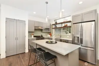 Kitchen has center island and pantry.
