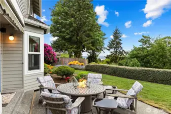 Perfectly positioned to take in the stunning natural surroundings, this inviting patio overlooks a peaceful greenbelt with a glimpse of Puget Sound beyond. Thoughtfully designed for seamless indoor-outdoor living, the space offers a relaxing setting for morning coffee, evening gatherings, or quiet reflection.