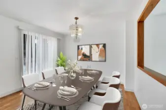 Dining area sits in front of slider door that steps out to deck for easy access to BBQ grill.