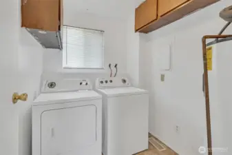 Laundry room offers some extra storage space to keep household items organized.
