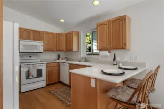 Kitchen with 2-person eat bar.