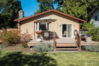 Access from the dining area to the sun-filled back deck.