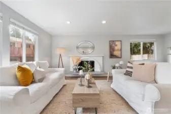 The cozy wood-burning fireplace anchors the spacious living room.