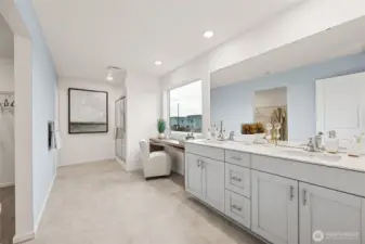 Large Primary bathroom with nook for makeup vanity or towel cabinet. Actual home is under construction and colors, materials, and finishes may vary. See site agent for details.