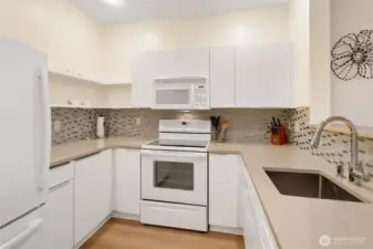 Ample cabinet space ensures that everything has its place here.