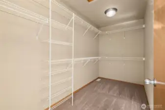 Primary bedroom walk-in closet