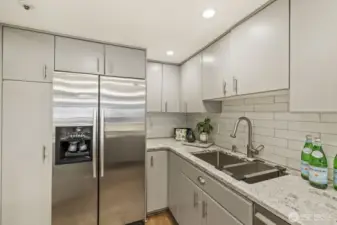 Stainless Steel Appliances, Pantry Closet with Pull Out Shelves, and Large Lazy Susan in the Corner Cabinet