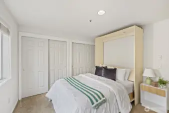 Secondary Bedroom features Wall of Closets