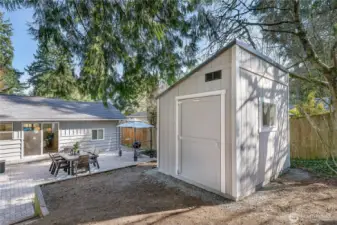 New shed with power, perfect for tools and outdoor gear.