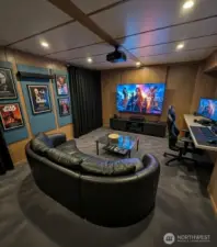 Basement Room accessed from garage- this photo has been virtually staged and rendered with possible future remodel. Great option for media room, office or fitness room. Does NOT look like this now.