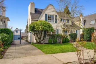 Spacious driveway parking for four or more vehicles, with a gated entry for added privacy and security.