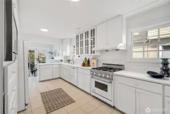 Well-appointed kitchen with generous storage, Viking range, built-in microwave, and plenty of cabinetry. Situated north of the dining room and east of the sunroom. An effortless layout for entertaining.