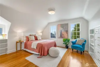 Second spacious bedroom upstairs with western mountain views and filtered views of the Sound. Features charming built-in drawers and shelving, plus a walk-in closet.