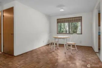 Dining room with window to backyard.