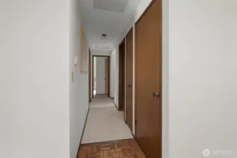 Hall to bedrooms, bathroom, linen closet and coat closet.