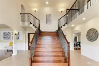 Beautiful grand entryway with split stairs.