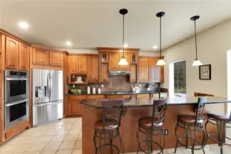 Lovely kitchen with double oven and top of the line cabinets and LG appliances.