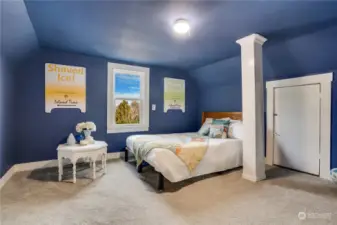 This designer paint brings freshness to this upstairs bedroom. The white trim really makes this color stand out